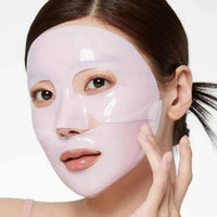 Masque Collagène PDRN Pink appliqué sur le visage — masque tissu gel au collagène, effet hydratant et repulpant